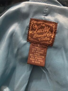 Lucky Brand Brown Label on Light Blue Lining